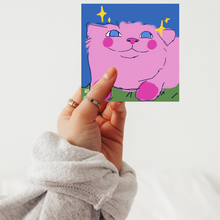 Load image into Gallery viewer, Pink cat gamer sticker with joyful smile, glossy vinyl finish, kawaii collectible for laptops and consoles - Glitter Bees Unite playful art.